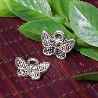 Dije Mariposa Mini Estilizada Tono Plata Envejecida 12.5x10mm | Pack 8 uds