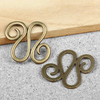 Conector Volutas en S Entrelazadas Estilo Tibetano Aleación Tono Bronce Envejecido 34x30x2mm | 2 uds