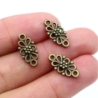 Conector Flor Calada con Pétalos en Lazo y Botones Centrales Estilo Tibetano Aleación Tono Bronce Envejecido 16x8x3.5mm | 12 uds