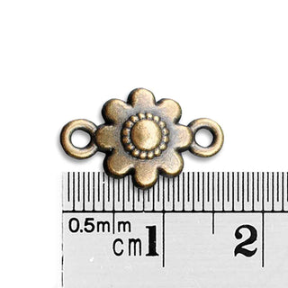 Conector Flor en Relieve con 8 Pétalos Redondeados y Botón Central Punteado Aleación Tono Bronce Envejecido 16x10mm | 5 uds