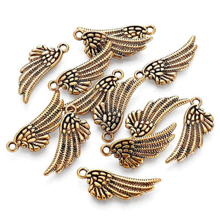 Dije Ala de Ángel de Aleación Estilo Tibetano Tono Oro Envejecido 29x11x2mm | 7 uds