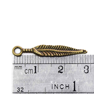 Dije Pluma Estilizada Estilo Tibetano Tono Bronce Envejecido 29x5mm | 16 uds