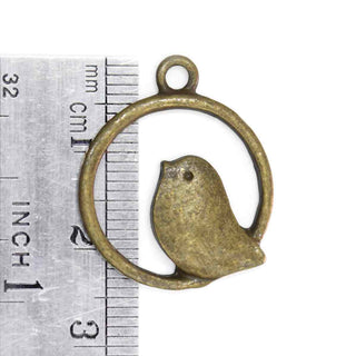 Dije Pájaro Posado en Aro Tono Bronce Envejecido 25x21x2mm | 6 uds