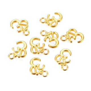 Dije Ohm Estilo Tibetano de Aleación Tono Oro 16x11x2mm | 9 uds