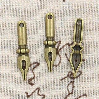 Dije Pluma Estilo Tibetano Tono Bronce Envejecido 32x7x3mm | 4 uds