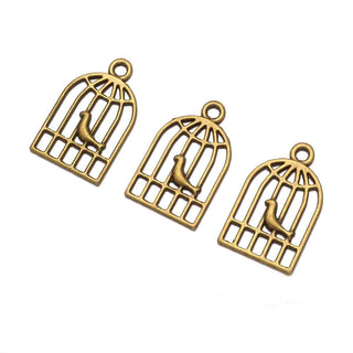 Dije Pajarito en Jaula Tono Bronce Envejecido 19x12x1mm | 8 uds
