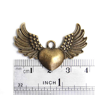 Dije Corazón con Alas Estilo Tibetano Tono Bronce Envejecido 25x36x4mm | 3 uds