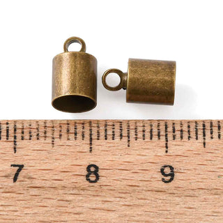 Terminal de cordón de latón, columna, color bronce envejecido, 10×6 mm, para cordón de 5,5mm. | 10 uds