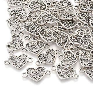 Enlaces de aleación, corazón calado, 12x21x1.5 mm.