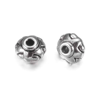 Sepadores de cuentas de metal, rondela, 7×5 mm. 12 unidades.