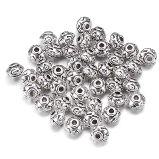 Sepadores de cuentas de metal, rondela, 7×5 mm. 12 unidades.