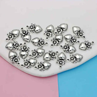 Dije Corazón Calado con Flores Estilo Mexicano en Relieve Tono Plata Envejecida 32.5x10mm | 10 uds