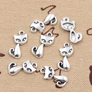 Dije Gato Sentado Tono Plata Envejecida 16.5x8.5mm | 12 uds