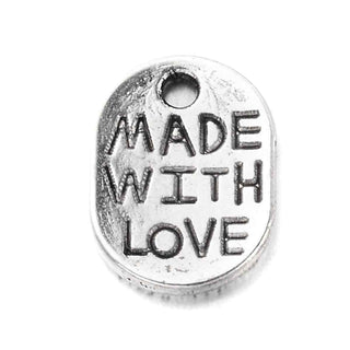 Dije Ovalado con Inscripción "Hecho con Amor" Tono Plata Envejecida 11x8.2mm | 16 uds