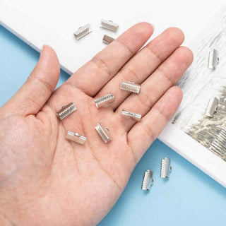 Tapacinta Tipo Carterita de Hierro Tono Platino Libre de Níquel 13×7×5 mm | 12 pares