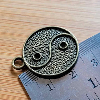 Base Colgante Yin Yang con Ajuste Cabujón 2,5–3mm Tono Bronce Envejecido 28x23mm | 2 uds.