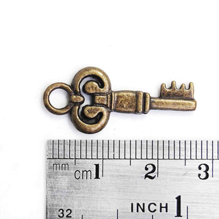 Dije Llave Estilo Tibetano de Aleación Tono Bronce Envejecido 28x12x2mm | 6 uds