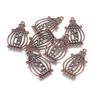 Dije Jaula Colgante con Pajarito Tono Cobre 34x20,5x2mm | 1 ud.