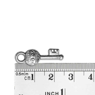 Dije Llave Tono Plata Envejecida 25x9x3mm | 5 uds.