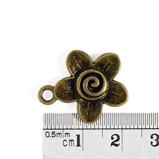 Dije Flor con Espiral Estilo Tibetano Tono Bronce Envejecido 22,5x19x3mm | 3 uds.