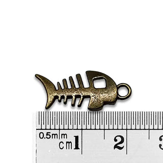 Dije Esqueleto de Pez Estilo Tibetano Tono Bronce Envejecido 21x11mm | 5 uds.