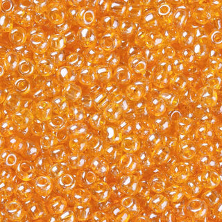 Mostacilla lustered 8/0. Abalorio de vidrio semi transparente con color brillante lustroso, varios tonos para seleccionar, 3 mm.