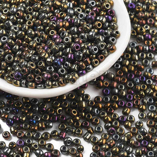 Mostacilla 8/0, cuentas de vidrio negro con visos cobre,bronce y púrpura, tamaño 3 mm de diámetro, agujero 1 mm.