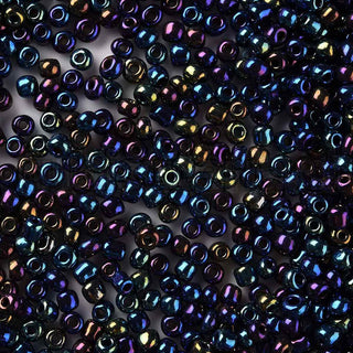 Mostacilla 8/0, cuentas de vidrio negro con visos azules pavo real, tamaño 3 mm de diámetro, agujero 1 mm.