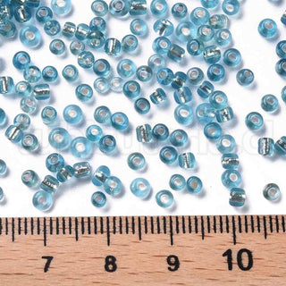 Mostacilla centro de plata 8/0. Abalorio de vidrio con orificio revestido, varios tonos para seleccionar, 3 mm.