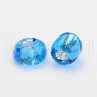 Mostacilla centro de plata 8/0. Abalorio de vidrio con orificio revestido, varios tonos para seleccionar, 3 mm.