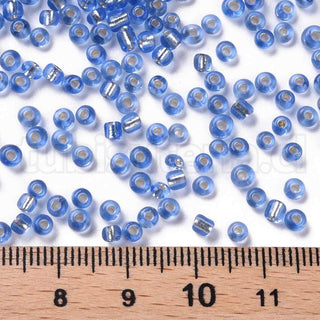 Mostacilla centro de plata 8/0. Abalorio de vidrio con orificio revestido, varios tonos para seleccionar, 3 mm.