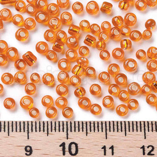 Mostacilla centro de plata 8/0. Abalorio de vidrio con orificio revestido, varios tonos para seleccionar, 3 mm.