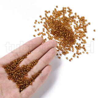 Mostacilla centro de plata 8/0. Abalorio de vidrio con orificio revestido, varios tonos para seleccionar, 3 mm.