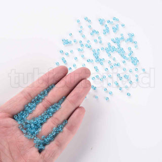 Mostacilla 8/0. Cuentas de vidrio redondeadas, color transparente, varios tonos para seleccionar,, cerca de 3 mm.