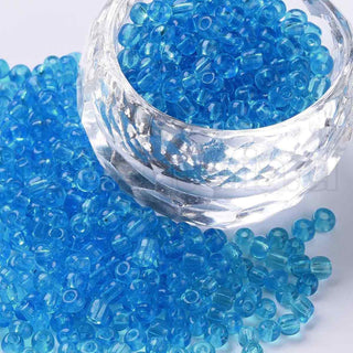 Mostacilla 8/0. Cuentas de vidrio redondeadas, color transparente, varios tonos para seleccionar,, cerca de 3 mm.