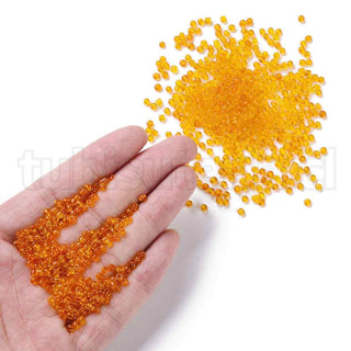 Mostacilla 8/0. Cuentas de vidrio redondeadas, color transparente, varios tonos para seleccionar,, cerca de 3 mm.