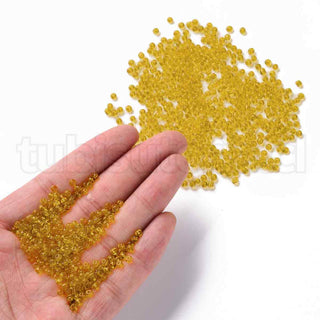 Mostacilla 8/0. Cuentas de vidrio redondeadas, color transparente, varios tonos para seleccionar,, cerca de 3 mm.