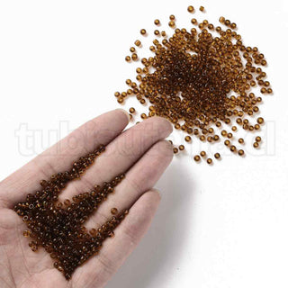 Mostacilla 8/0. Cuentas de vidrio redondeadas, color transparente, varios tonos para seleccionar,, cerca de 3 mm.